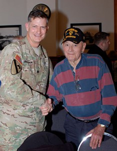 CGSC instructor Lt. Col. Joe Donalbain shakes hands with retired Lt. Col. Norm McCloud a veteran of the 1st Cavalry Division in Vietnam.